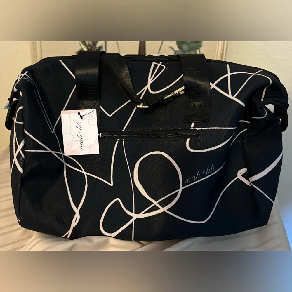 NWT Mali + Lili weekend bag in black and white design on canvas. Plenty of room